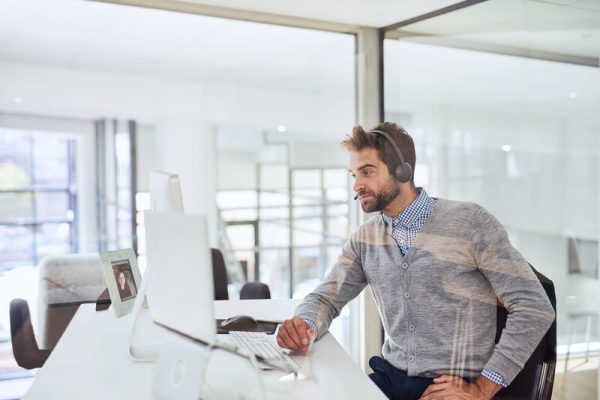 Man on call using headphones
